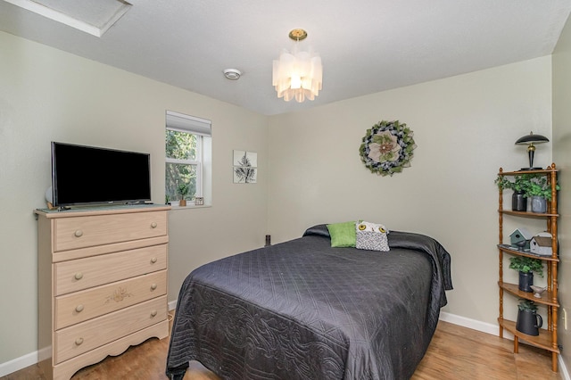 38630 Woodview Ln, Le Center, MN 56057 - bedroom with light wood-style flooring and a chandelier
