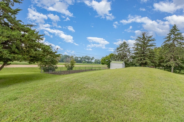 38630 Woodview Ln, Le Center, MN 56057 - view of yard featuring a storage shed and a rural view