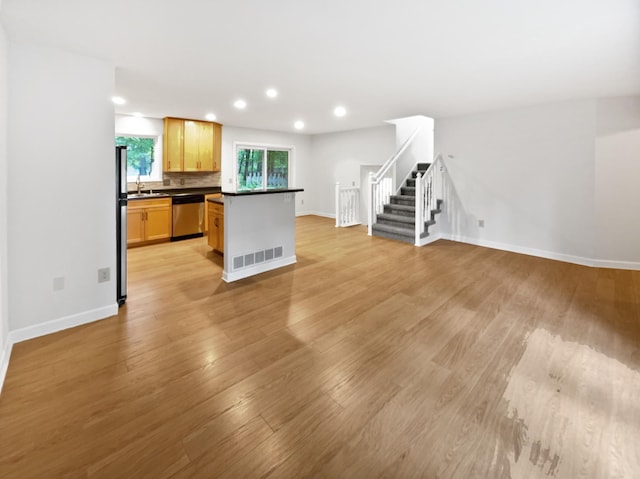 7040 Winfield Rd, Rockford, MN 55373 - kitchen with appliances with stainless steel finishes, dark countertops, baseboards, a sink, and recessed lighting