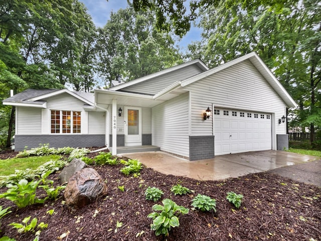 7040 Winfield Rd, Rockford, MN 55373 - view of front of property featuring brick siding, an attached garage, and concrete driveway