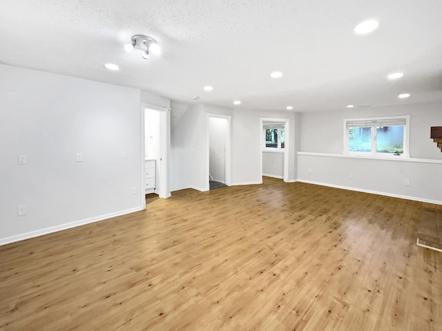 7040 Winfield Rd, Rockford, MN 55373 - unfurnished room with recessed lighting, wood finished floors, and baseboards