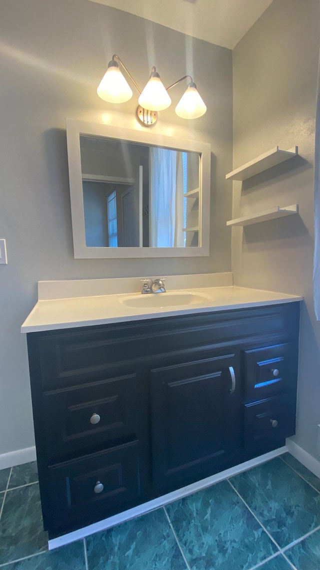 703 Laurel Ave Unit 4W, Saint Paul, MN 55104 - bathroom featuring vanity, baseboards, and tile patterned floors