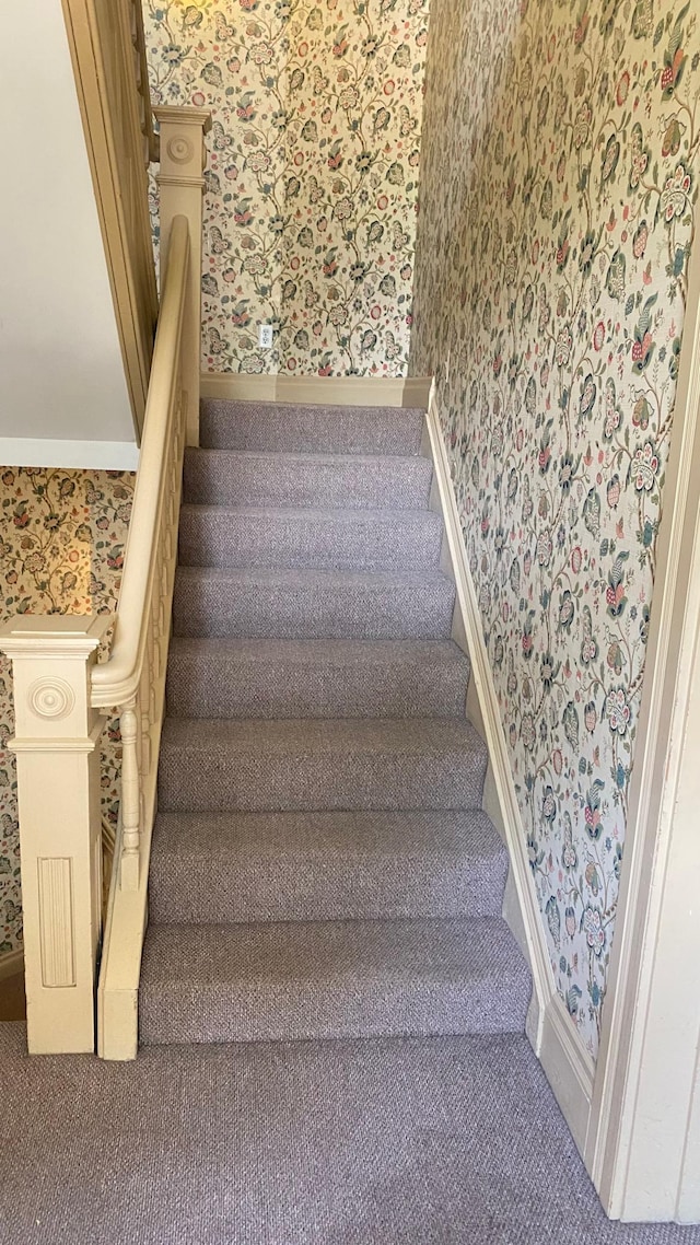 703 Laurel Ave Unit 4W, Saint Paul, MN 55104 - stairway featuring wallpapered walls and carpet flooring