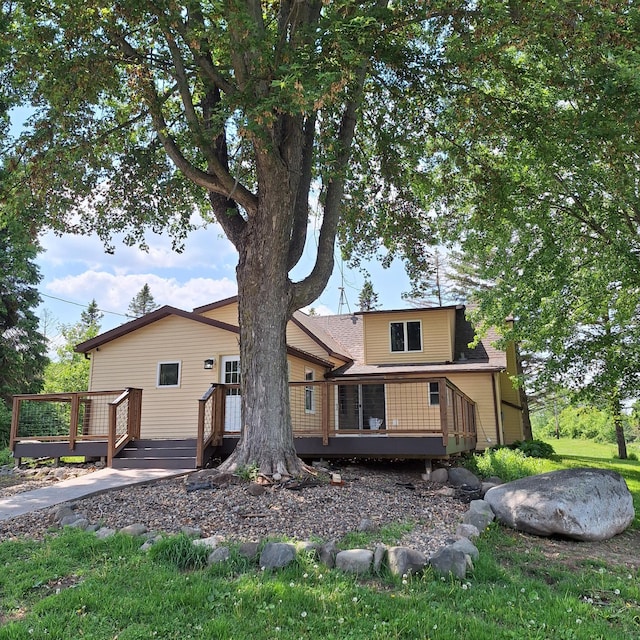 1334 105th Ave, Amery, WI 54001 - rear view of house with a wooden deck and roof with shingles
