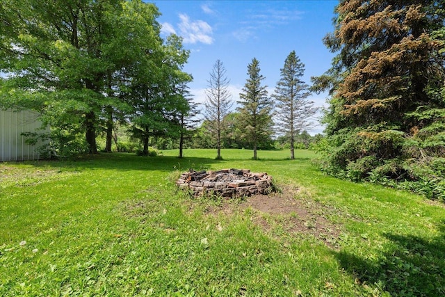1334 105th Ave, Amery, WI 54001 - view of grassy yard with a fire pit
