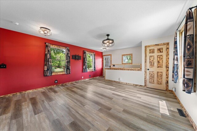 1334 105th Ave, Amery, WI 54001 - unfurnished living room with wood finished floors
