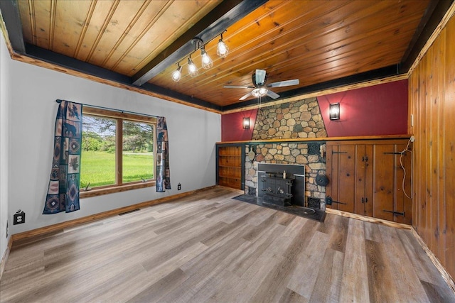 1334 105th Ave, Amery, WI 54001 - unfurnished living room with wood ceiling, wood finished floors, ceiling fan, baseboards, and track lighting