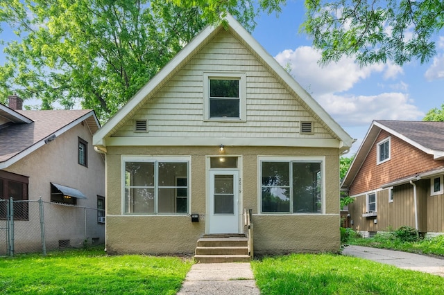 2619 23rd Ave N, Minneapolis, MN 55411 - bungalow-style house featuring entry steps and stucco siding