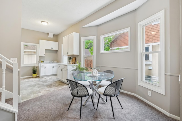 2619 23rd Ave N, Minneapolis, MN 55411 - dining room with light carpet and stairs