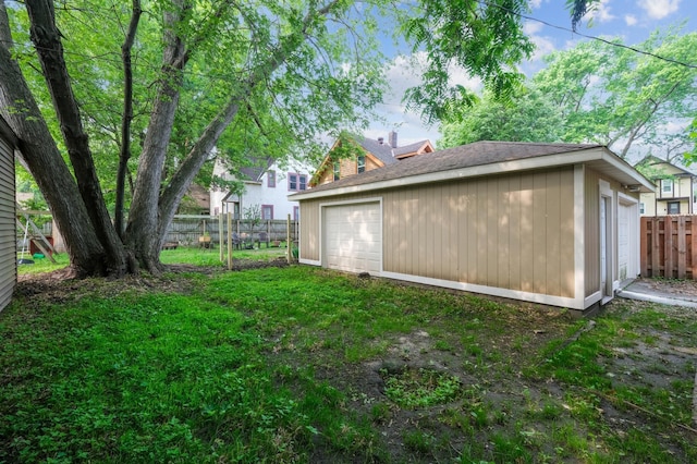 2619 23rd Ave N, Minneapolis, MN 55411 - view of yard featuring a garage and an outbuilding