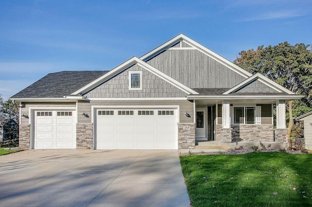 12620 Overlook Rd, Dayton, MN 55327 - craftsman-style house with a garage, concrete driveway, stone siding, and a front lawn