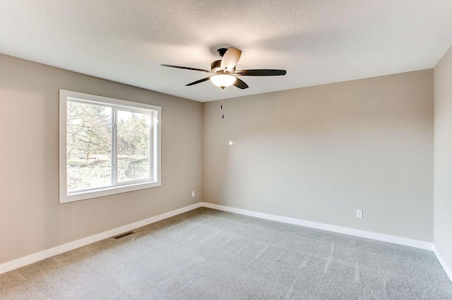 12620 Overlook Rd, Dayton, MN 55327 - carpeted spare room with a ceiling fan, baseboards, and a textured ceiling