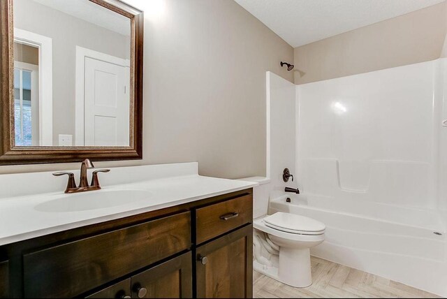 12620 Overlook Rd, Dayton, MN 55327 - full bathroom featuring vanity, bathtub / shower combination, and toilet
