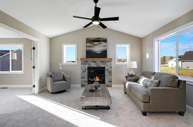 12620 Overlook Rd, Dayton, MN 55327 - living room with ceiling fan, light carpet, a fireplace, healthy amount of natural light, and lofted ceiling