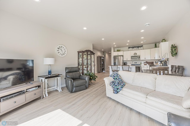 6782 68th St S, Horace, ND 58047 - living room with light wood-style floors, recessed lighting, and baseboards