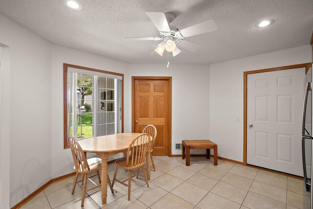 9479 Prairieview Trl N, Champlin, MN 55316 - dining space featuring baseboards, a ceiling fan, a textured ceiling, recessed lighting, and light tile patterned floors
