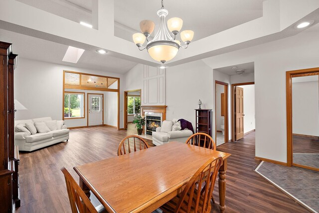 9479 Prairieview Trl N, Champlin, MN 55316 - dining area featuring a fireplace, recessed lighting, wood finished floors, and baseboards