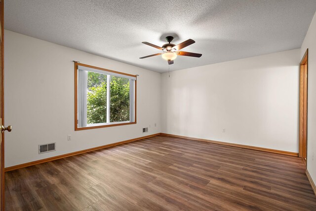 9479 Prairieview Trl N, Champlin, MN 55316 - spare room with wood finished floors, ceiling fan, baseboards, and a textured ceiling