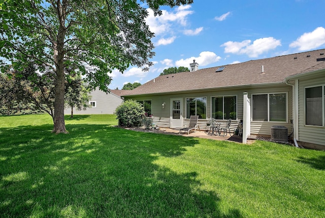9479 Prairieview Trl N, Champlin, MN 55316 - view of grassy yard with a patio and central AC