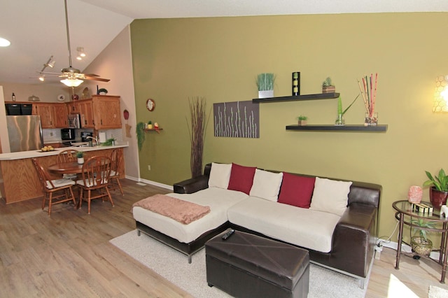 653 86th Ln NW, Coon Rapids, MN 55433 - living area featuring light wood-style flooring, ceiling fan, lofted ceiling, and recessed lighting