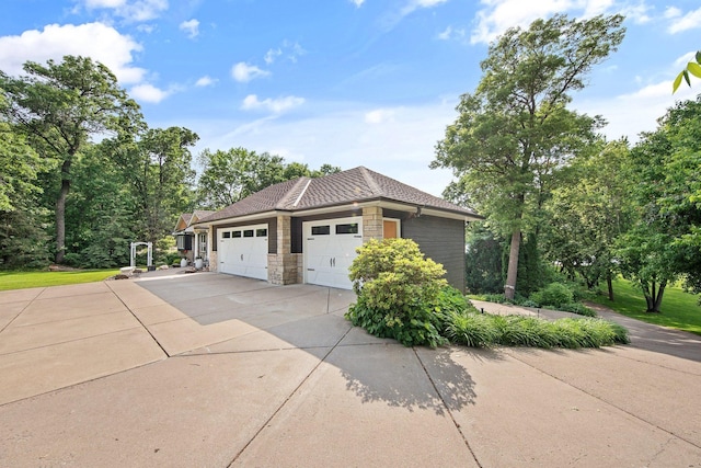 22946 185th St NW, Orrock Twp, MN 55309 - view of home's exterior with a garage, stone siding, and driveway