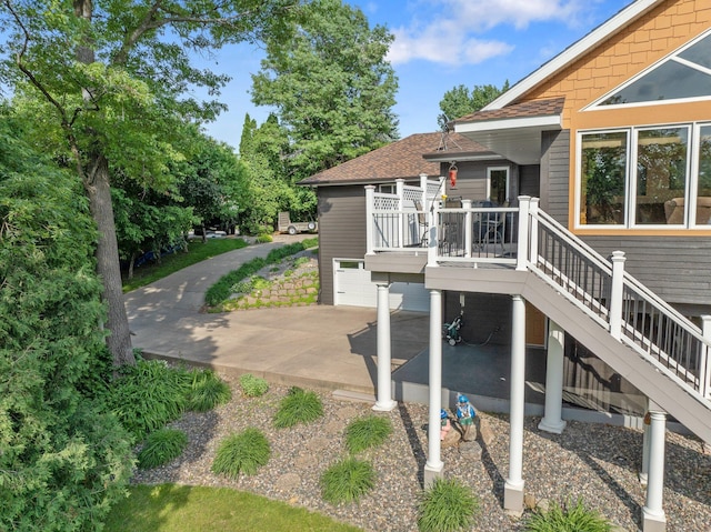 22946 185th St NW, Orrock Twp, MN 55309 - exterior space with a deck, roof with shingles, a patio area, and stairs