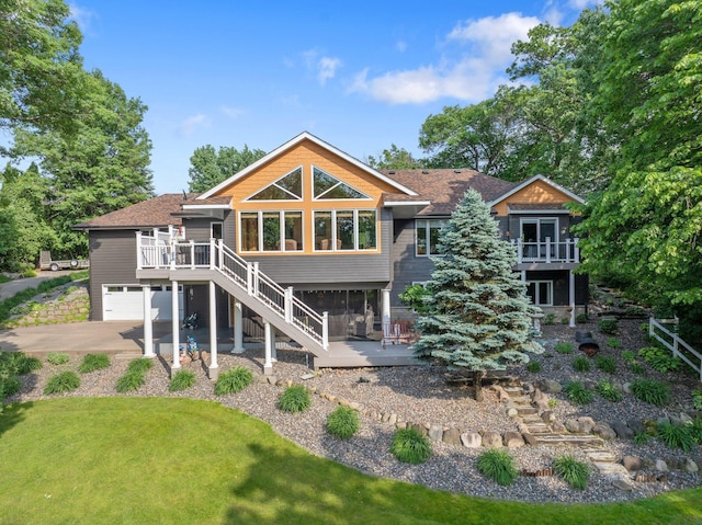 22946 185th St NW, Orrock Twp, MN 55309 - rear view of house with stairs, a wooden deck, and a garage