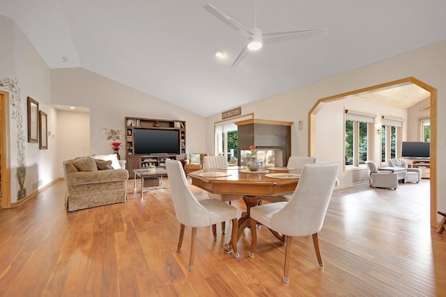 22946 185th St NW, Orrock Twp, MN 55309 - dining area with vaulted ceiling, light wood finished floors, and ceiling fan