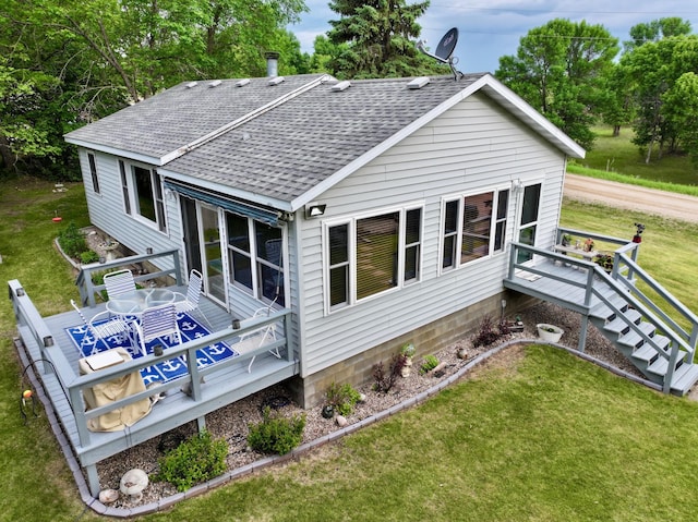 45909 Lands End Rd, Vergas, MN 56587 - rear view of house featuring roof with shingles, a lawn, and a deck