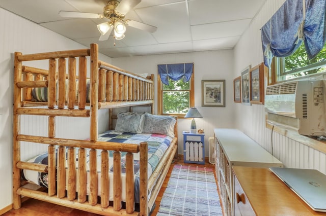 45909 Lands End Rd, Vergas, MN 56587 - bedroom with multiple windows, wood finished floors, and a paneled ceiling