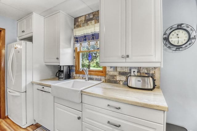 45909 Lands End Rd, Vergas, MN 56587 - kitchen with white appliances, white cabinetry, and tasteful backsplash
