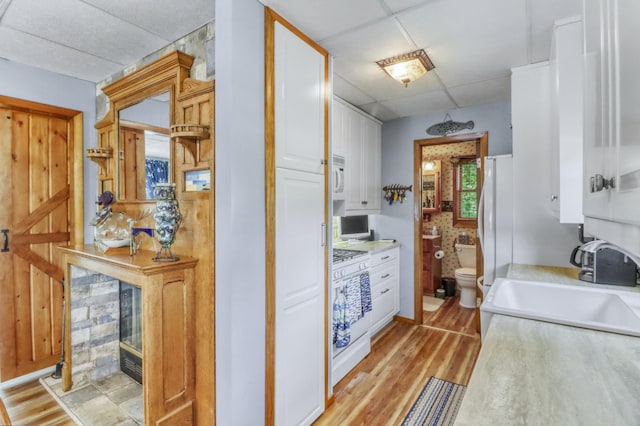 45909 Lands End Rd, Vergas, MN 56587 - bathroom featuring wood finished floors, a shower, and a drop ceiling