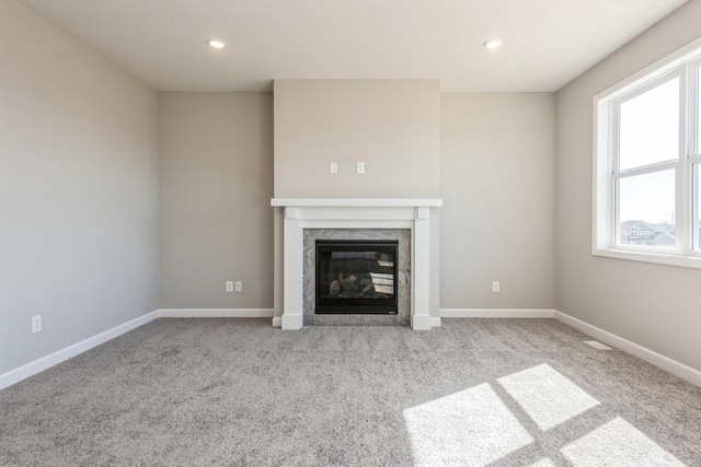 8335 Lander Ave NE, Otsego, MN 55330 - unfurnished living room with a fireplace, carpet flooring, baseboards, and recessed lighting