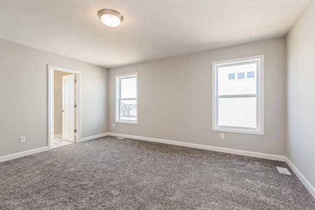 8335 Lander Ave NE, Otsego, MN 55330 - carpeted empty room featuring baseboards