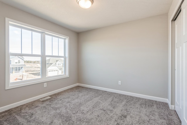 8335 Lander Ave NE, Otsego, MN 55330 - unfurnished bedroom featuring carpet flooring, baseboards, and a closet