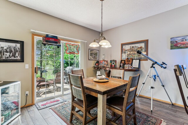 4505 Victor Path Unit 7, Hugo, MN 55038 - dining area with beverage cooler, wood finished floors, a textured ceiling, and baseboards