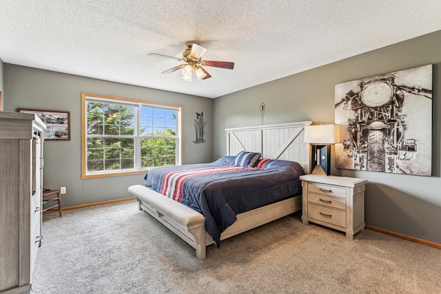 4505 Victor Path Unit 7, Hugo, MN 55038 - carpeted bedroom featuring baseboards, a textured ceiling, and ceiling fan