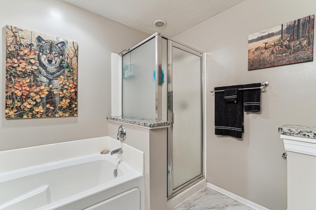 4505 Victor Path Unit 7, Hugo, MN 55038 - full bath with a shower stall, marble finish floors, a bath, a textured ceiling, and baseboards