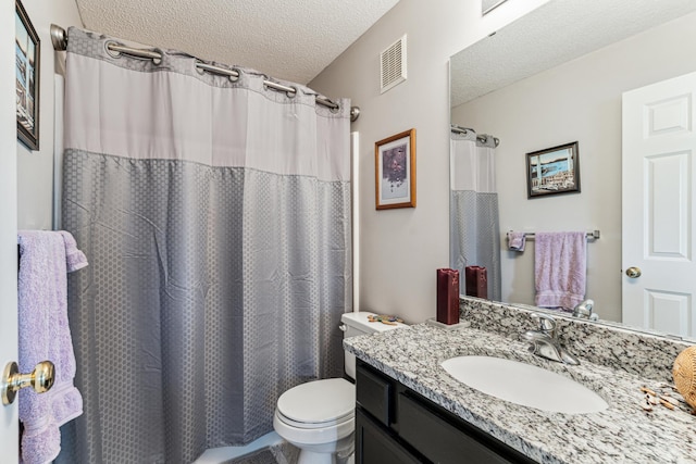 4505 Victor Path Unit 7, Hugo, MN 55038 - bathroom with toilet, vanity, and a textured ceiling
