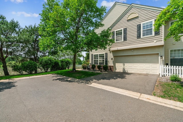 4505 Victor Path Unit 7, Hugo, MN 55038 - view of front of house featuring driveway, an attached garage, and brick siding