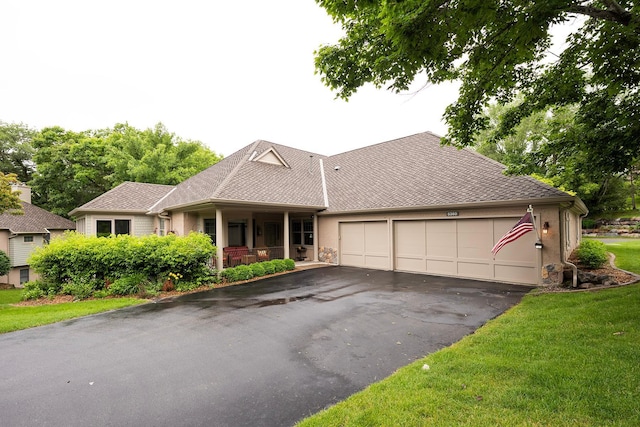 5360 Ashcroft Rd, Minnetonka, MN 55345 - ranch-style house with asphalt driveway, a garage, a front lawn, covered porch, and roof with shingles