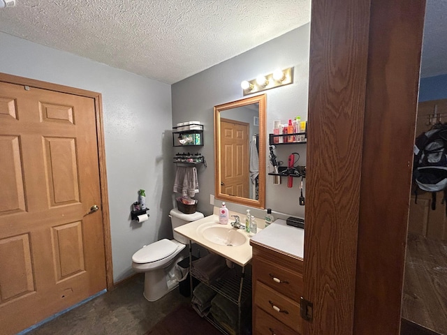 905 Fair Ave, Park Rapids, MN 56470 - bathroom with vanity, toilet, and a textured ceiling