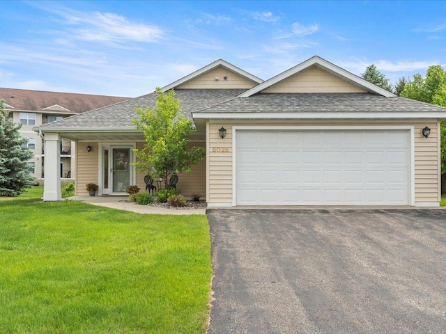 8025 Dalton Rd, Baxter, MN 56425 - ranch-style house with a shingled roof, asphalt driveway, a front lawn, and a garage
