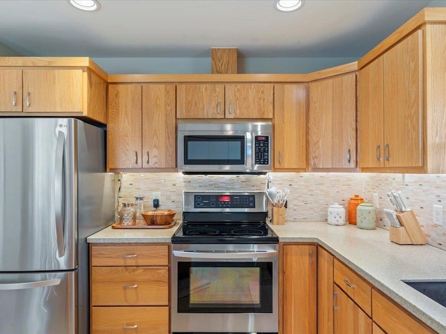 8025 Dalton Rd, Baxter, MN 56425 - kitchen featuring stainless steel appliances, backsplash, and recessed lighting