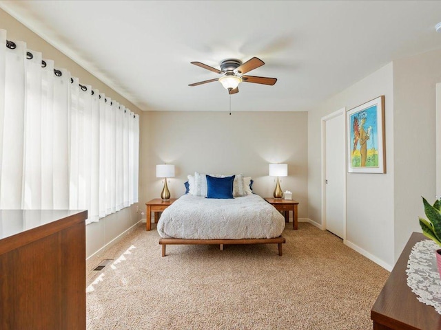8025 Dalton Rd, Baxter, MN 56425 - bedroom with light colored carpet, baseboards, and a ceiling fan
