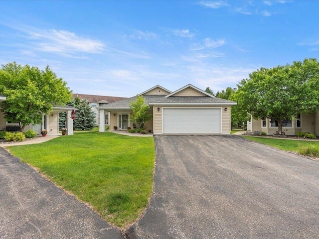 8025 Dalton Rd, Baxter, MN 56425 - ranch-style home featuring asphalt driveway, an attached garage, and a front lawn