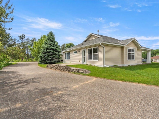8025 Dalton Rd, Baxter, MN 56425 - ranch-style home featuring a front lawn and roof with shingles