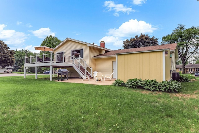 2261 Clark St, Eagan, MN 55122 - back of house featuring a wooden deck, a patio area, a lawn, stairway, and a chimney