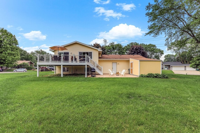 2261 Clark St, Eagan, MN 55122 - back of property with stairs, a wooden deck, a lawn, and a patio area