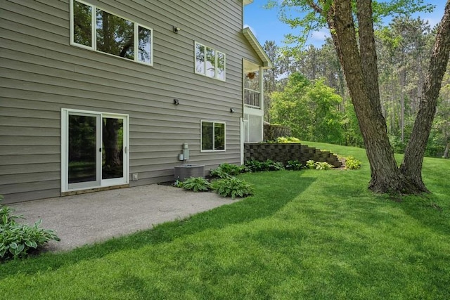 17575 Xenia St NW, Andover, MN 55304 - back of house featuring a lawn and a patio area